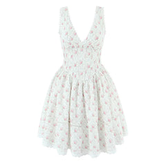 White dress with pink floral pattern on a white background