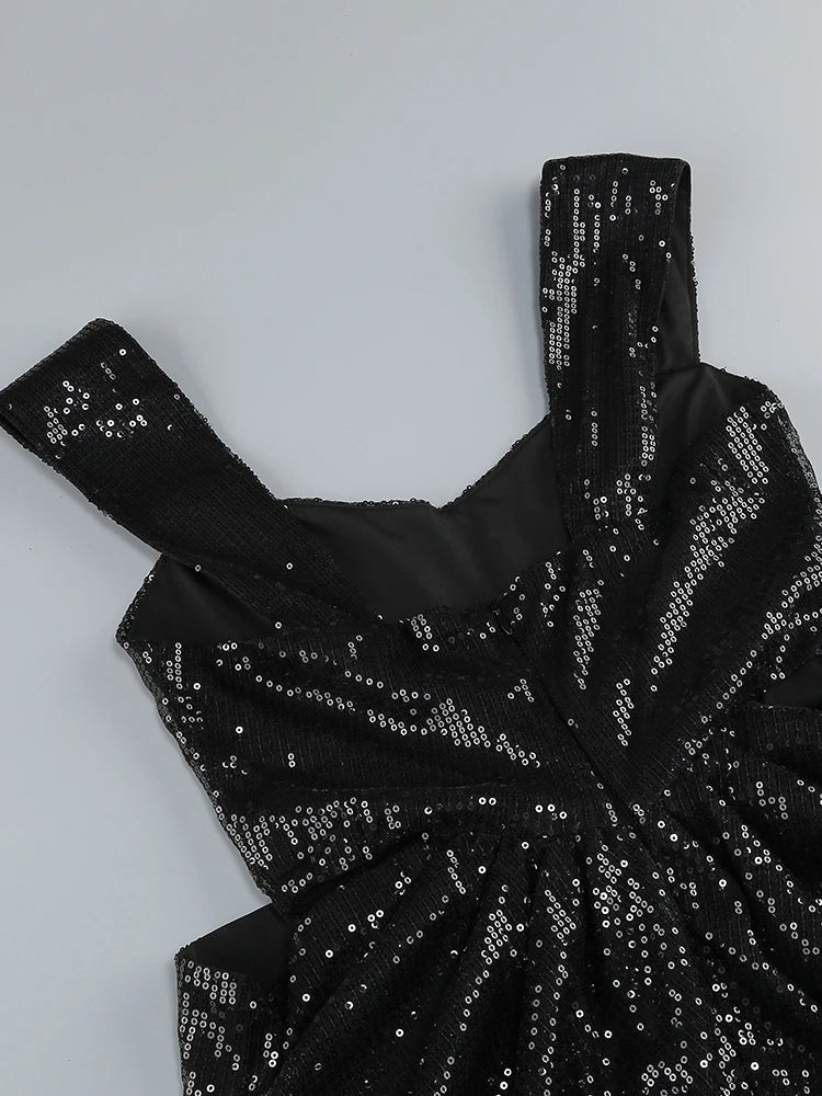 Black sequin dress on a light gray background