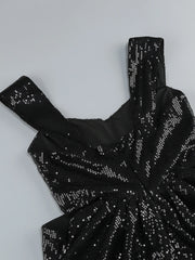 Black sequin dress on a light gray background