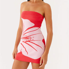 Red and white strapless dress with floral design on a white background