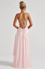 Pink dress with criss-cross back design on a white background