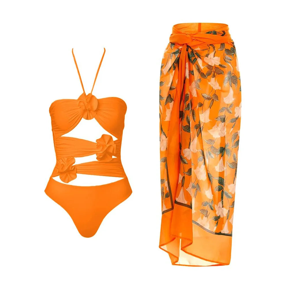 Orange floral one-piece swimsuit and matching cover-up skirt.