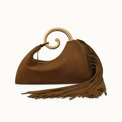 Brown handbag with gold handle and tassels on a white background