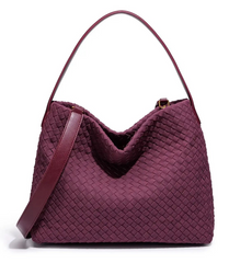 Maroon woven handbag on a white background