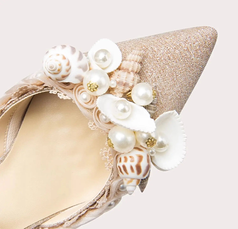 Decorative headband with pearls and shells on a light background