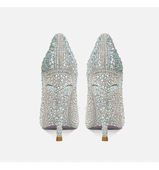 Pair of embellished high-heeled shoes on a white background
