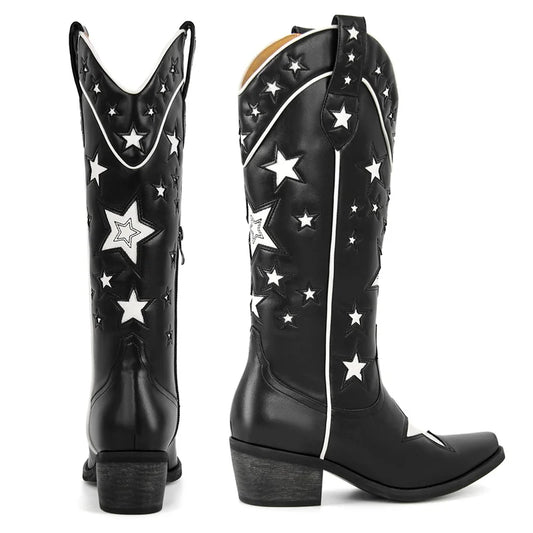 Black leather cowboy boots with white star patchwork and pointed toe, side view.