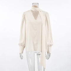 White blouse on a mannequin against a white background