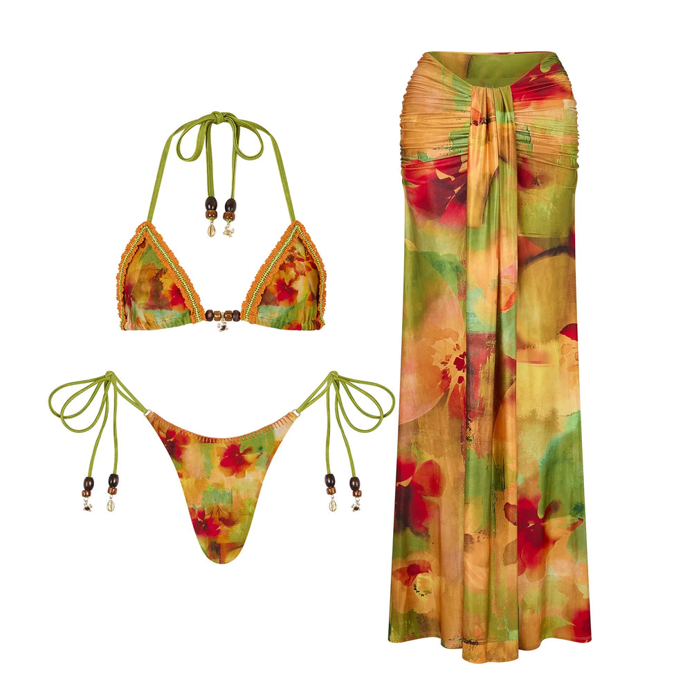 Flat lay of a printed bikini top and bottom with a matching long skirt.