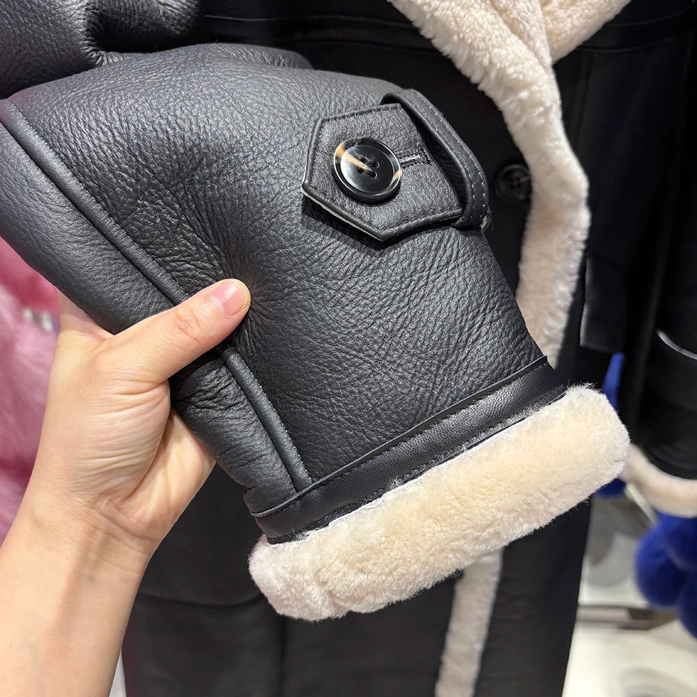 Black leather boot with white fur lining held by a hand