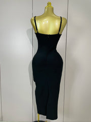 Black dress on a mannequin against a white wall
