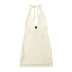 White halter top with black flower detail on a white background