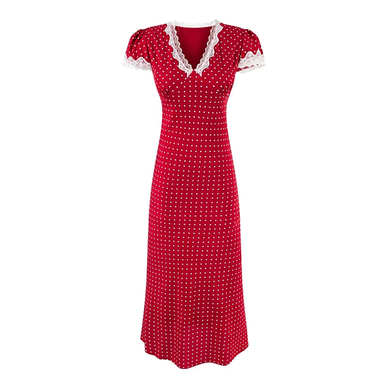 Red polka dot dress with white lace trim on a white background