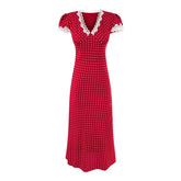 Red polka dot dress with white lace trim on a white background