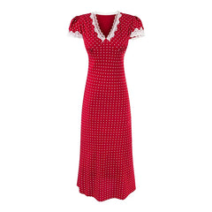 Red polka dot dress with white lace trim on a white background