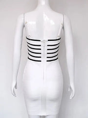 White dress with black stripes on a mannequin against a white background