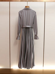 Gray dress with a belt on a mannequin against a light background
