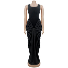 Black evening gown on a mannequin against a white background