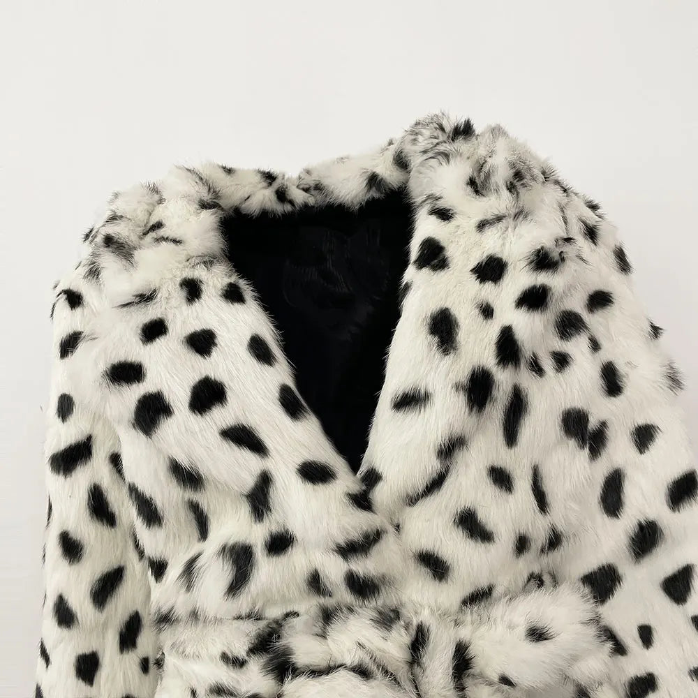 White fur coat with black spots on a white background