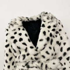 White fur coat with black spots on a white background