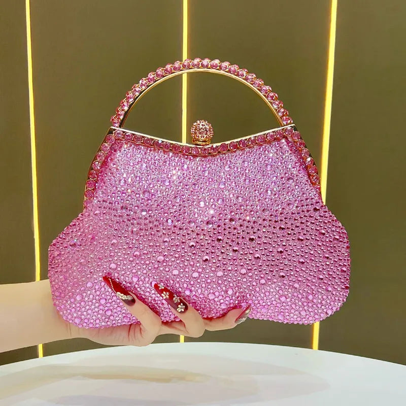 Pink crystal-encrusted top handle clutch bag