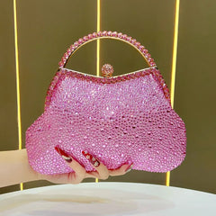 Pink crystal-encrusted top handle clutch bag