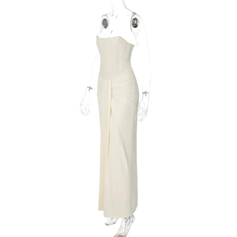 White strapless gown on a mannequin against a white background