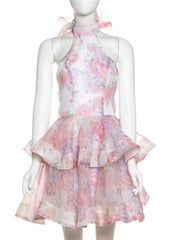 Floral dress on a mannequin against a white background