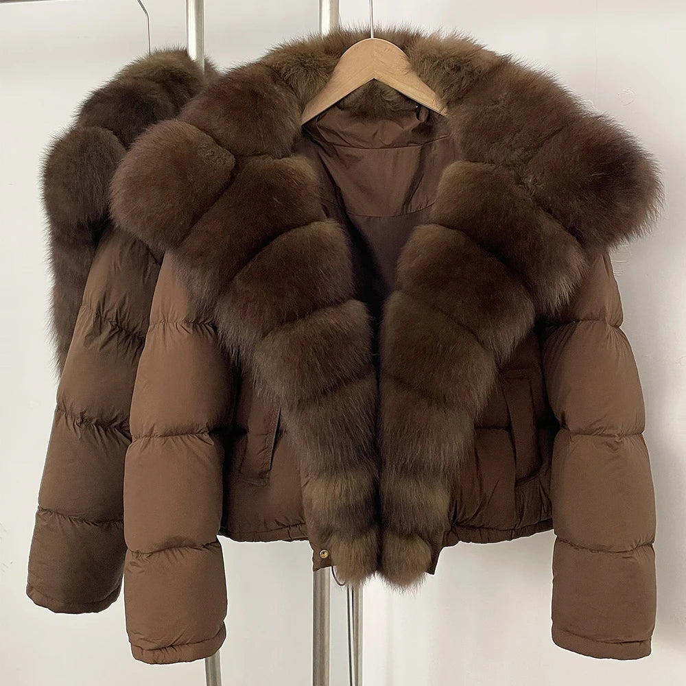 Brown puffer jacket with fur trim on a hanger against a white background