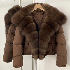 Brown puffer jacket with fur trim on a hanger against a white background