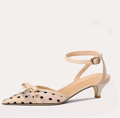 Beige sandal with polka dot pattern on a white background