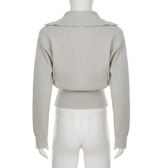 Rear view of knitted pullover showing smooth shoulder line and lightweight knit shaping