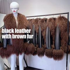 Mannequin wearing a black leather jacket with brown fur trim against a white background.
