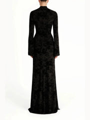 Black evening gown with long sleeves on a white background