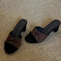 Brown open toe square heel mules with stitched trim and bow detail