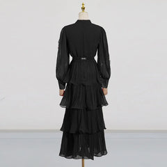 Black dress on a mannequin against a white background