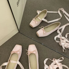 Pair of pink square-toe flats with ribbon ties