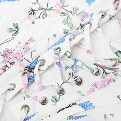 Floral-patterned shoelaces on a white background