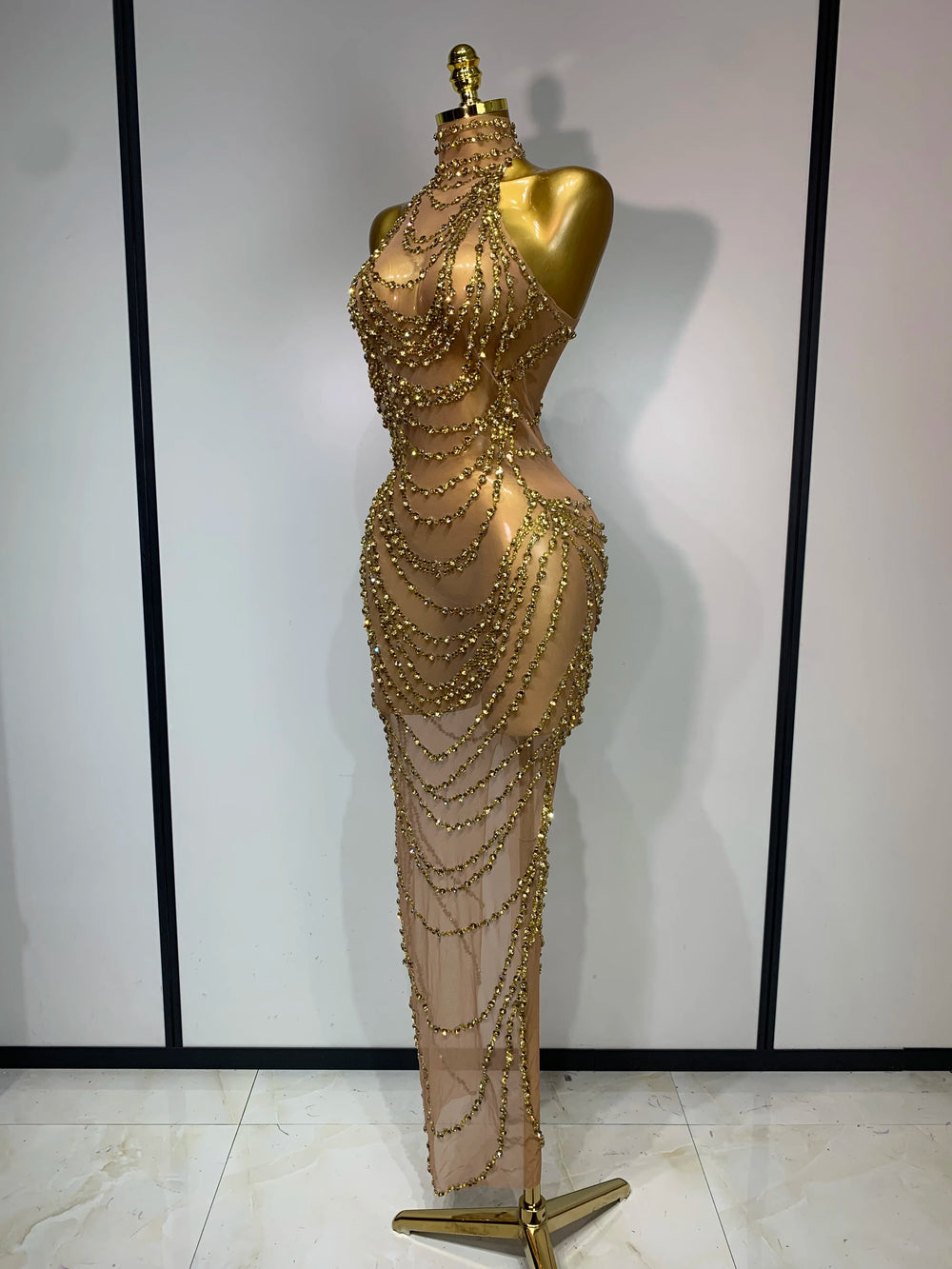Back view of chain embellished halter gown