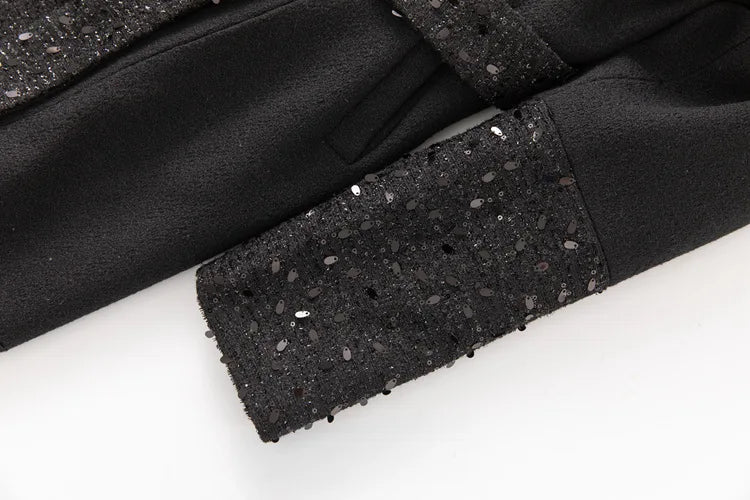 Detail of sequin embellishment on coat sleeve