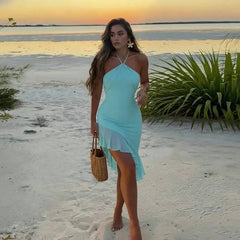 Light blue ruffled asymmetrical mini dress on beach