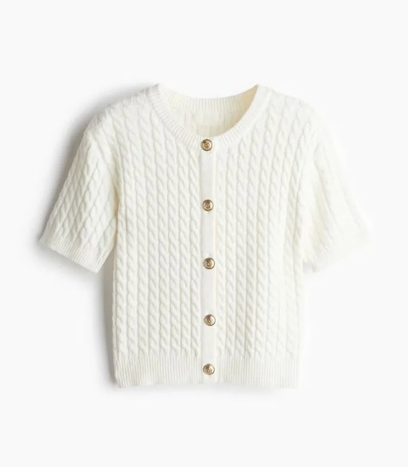 White textured cardigan with button details on a white background