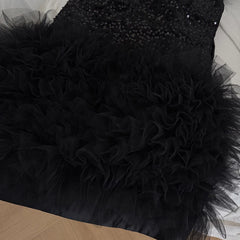 Close-up of the textured black ruffle skirt detail