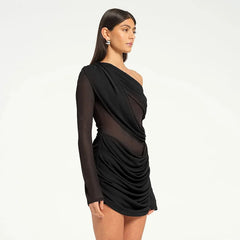 Black one-shoulder dress worn by a model- side details