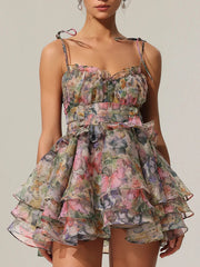 Woman wearing a floral dress against a neutral background