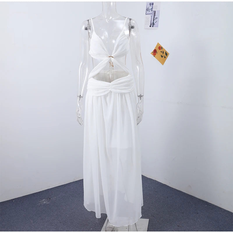 White dress on a mannequin against a plain white wall.