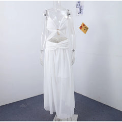 White dress on a mannequin against a plain white wall.