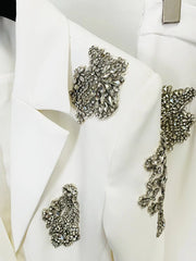 White blazer with decorative silver embellishments