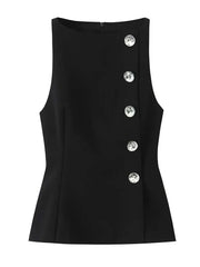 Black sleeveless top with decorative buttons on a white background
