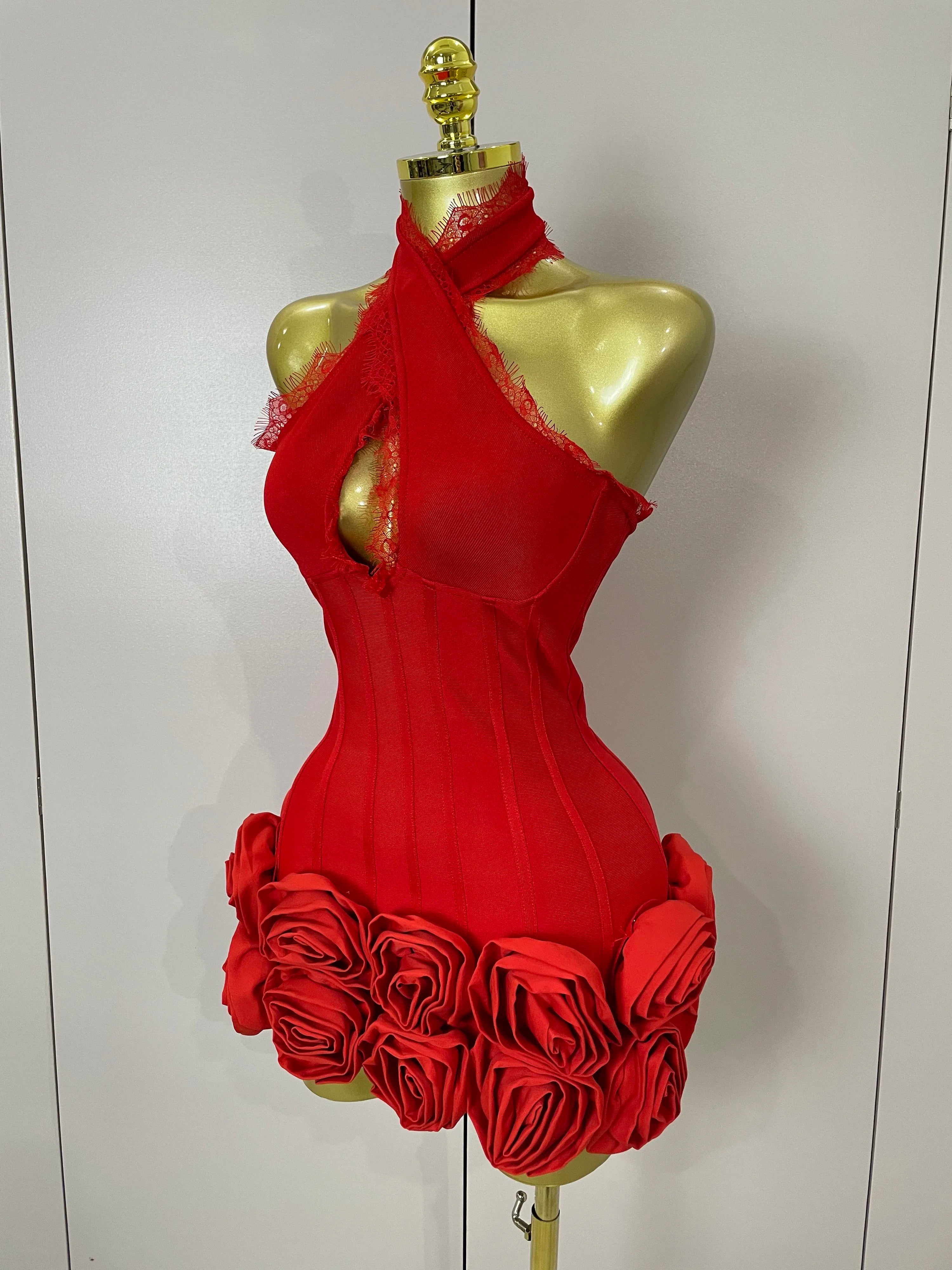 Red dress with floral details on a mannequin against a white background